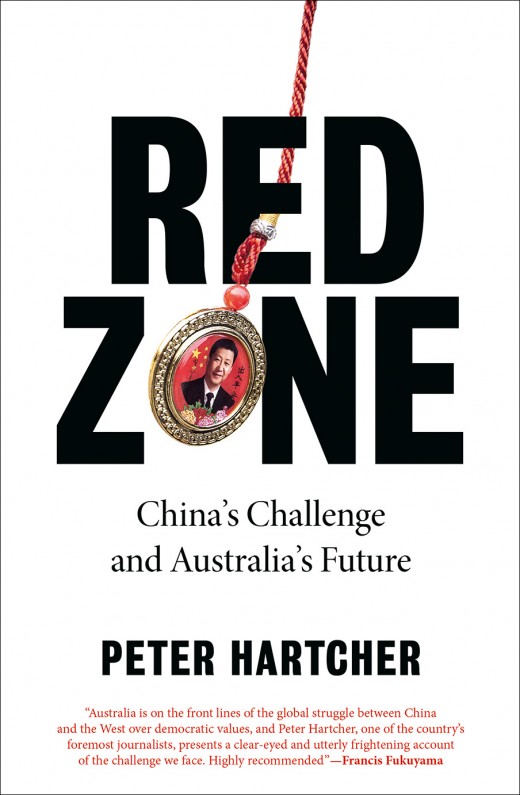 white cover with pendant on the end of a red rope with a portrait of a Chinese political figure